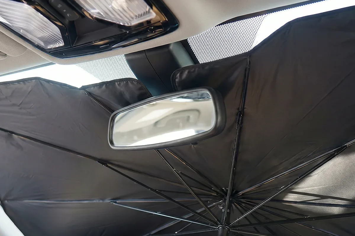 Positioning the windshield umbrella around the mirror